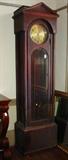 206 - Mahogany empire Grandfather clock with column front weight driven, working condition, 90in. T, 24in. W, 16in. D.