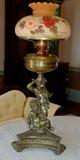 250 - Oil lamp with cherubs, double burner, 31in. T.