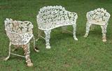 253 - White cast iron garden bench. 
254 - Pair of white cast iron garden chairs.