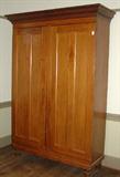 300 - Primitive cherry 2 door wardrobe on turned legs, ca. 1840, 87in. T, 61in. W, 22in. D.