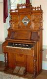 397 - Tall oak pump organ with gingerbread crown, 7ft t, 45in. W, 24in. D, ca. 1900.