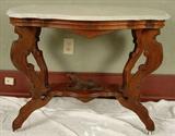 1 - Walnut  Victorian Mable top table with dog on base, 29in. T, 37in. L, 23in. D.