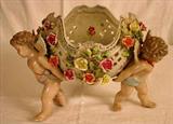 120 - Late Meissen porcelain center piece with 2 cherubs and crossed swords mark.