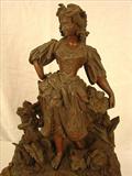 140 - French two tone dore bronze figural mantle clock with porcelain dial, 24in. T, 18in. W.