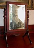 163 - Small mahogany empire cheval shaving mirror with hoof feet.