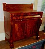 211 - Mahogany empire Jackson press with  scroll feet and chimney back splash, 51in. T, 46in. W, 22in. D.