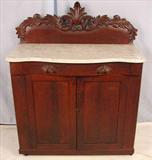 270 - Mahogany Victorian marble top server with carved back splash, 50in. T, 41in. W, 19in. D. ca. 1870.