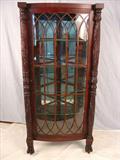 275 - Mahogany empire corner china cabinet with acanthus carved column front, glass shelves, 68in. T, 32in. W, 25in. D, signed R.J. Horner, ca. 1890.