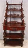 278a - Walnut Victorian etagere with pierced carved trim, grapes carved on pulls, 68in. T, 38in. W, 18in. D, ca. 1870.
