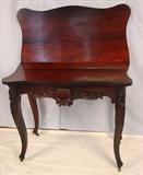280 - Rosewood Victorian game table with carved apron and legs, ca. 1860.