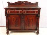 521 - Empire flame mahogany sideboard with carved backsplash, ca. 1840.