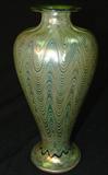 263 - Green Signed L.T.C. Tiffany Iridescent Art Glass Vase with Upward Threaded Design 9.25 in. T. X 4 in. Dia.