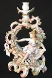227 - Dresden Candelabra with Girl and Cupid with Applied Flowers 14 in. T. X 9 in. W., close-up