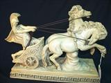 395 - Molded Composition Statuette Signed Asantini of Roman Soldier Being Pulled in Chariot by Pair of Horses 10 in. T. X 14.5  in. W. X 55 in.