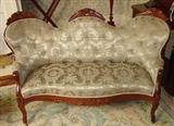 120 - Walnut Victorian Love Seat with Carved Roses Crown and Green Silk Upholstry