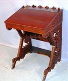 14 - Walnut Victorian Slant Top writing desk with heavy carved ends, 36in. Tall, 25in. Wide, 20in. Deep, ca. 1890