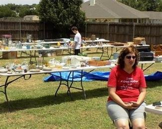 Lots of tables full of stuff outside.