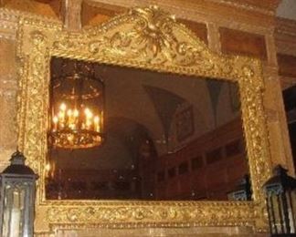 The large guilt mirror adorning the Park Ave., Fireplace