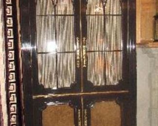 One of pair custom made Bronze’s accented cabinets