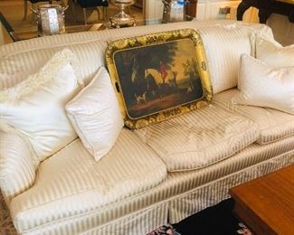 One of a pair of silk sofas