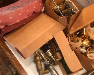 Lots of brass and gold plated bathroom plumbing handles and piping