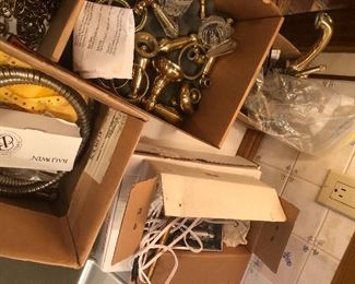 Lots of brass and gold plated bathroom plumbing handles and piping