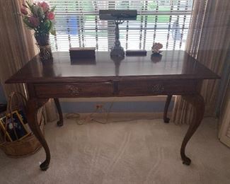 Maple finish desk with Queen Anne legs