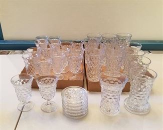 lot of goblets and glasses with coasters