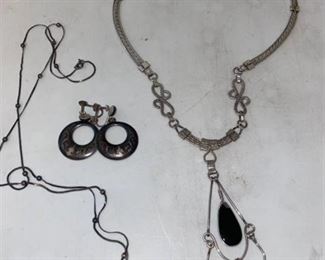 two necklaces, one earring set