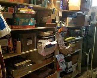 all contents on shelves - in basement - bring boxes - lots of games and electronics
