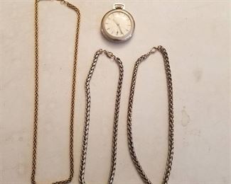 3 necklaces and a watch