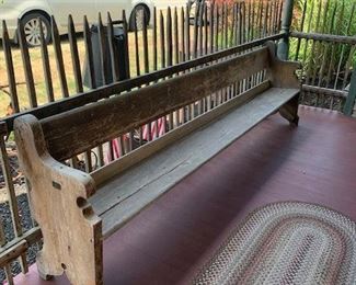 This church pew is early and very sturdy.  design on ends. 
