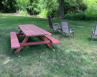 Picnic table and lawn chairs.