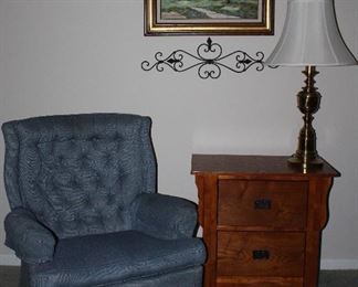 Blue Upholstered Button Tufted Swivel Rocker Easy Chair (1 of 2 shown) shown with Oak 2-Drawer End Table and An Original Oil on Canvas Texas Blue Bonnet Landscape (27” x 22.5”)