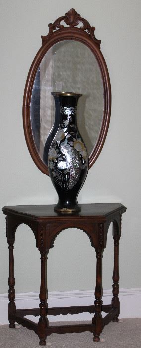 Antique Demi Lune/Half Hexagonal Tbale w/Turned Legs and Stretchers (30”W x 30”H x 15”D). Antique Carved Wood Framed Bevel Mirror w/Carved Floral Crown (21” x 40”)