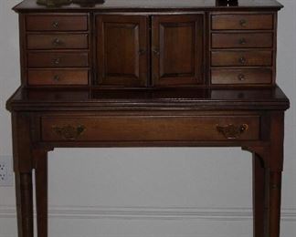2nd View: Vintage Spinet Desk with Drawers and Pockets on Pad Feet (34”W x 40”H x 18’D), Vintage/Antique Solid Brass 12” Bee Hive Candlesticks and Amber 1920’s Lysol Bottle