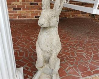 One of 2 large concrete rabbits. 