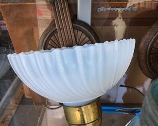 Clam shell glass lamp shades on art deco wall sconces