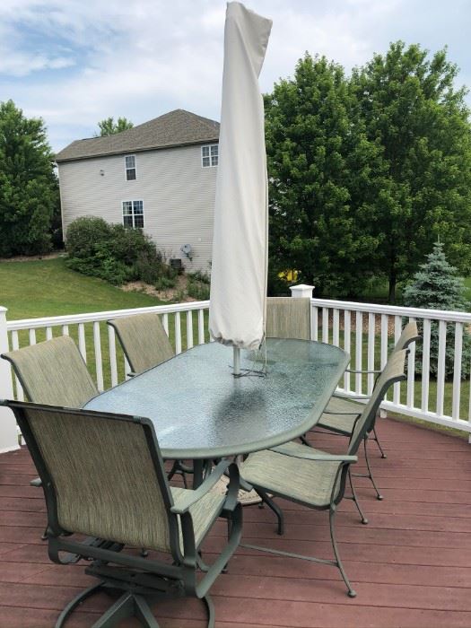 Outdoor Patio Set  8 Chairs Included with very sturdy 4 sectioned umbrella and stand.  $550  #1