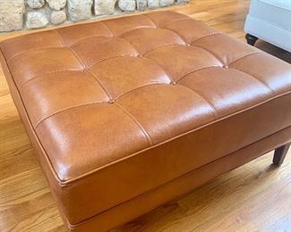 Tufted leather ottoman by Ethan Allen