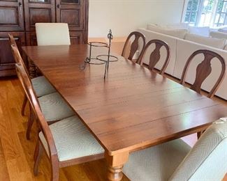 90” long farm-style table (with one 18” leaf already in & an extra one too) made by Ethan Allen, plus 8 chairs