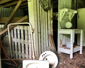 Sinks, lumber, creative furniture piece out of a door, all in the barn