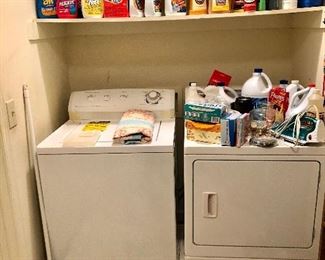 Washer and dryer and look at those cleaning supplies!