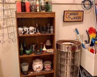 Times display case, metal hummingbird and plate hangers, shelves are all full!