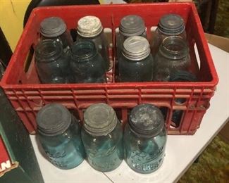 Lots of the blue canning jars many with lids