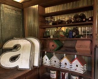 Big a's, log bird houses, wood shelves, all in the barn