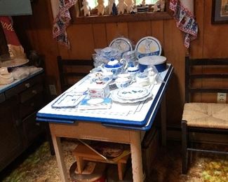 Enamel top table and Pillsbury collectibles. Two of four  black, rush seated chairs 