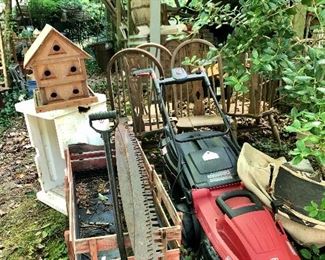 Lawn mower, wagon, 4 oak chairs that have been out in the weather, saw blades and more