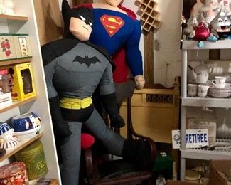 Life size Superman and Batman fighting for a seat on that rocker!