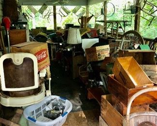 Loaded back porch, barber's chair, wood crates. Check out more back porch pics
